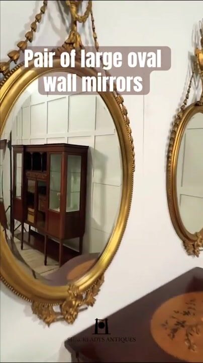 Film of Pair of Large Oval Wall Mirrors