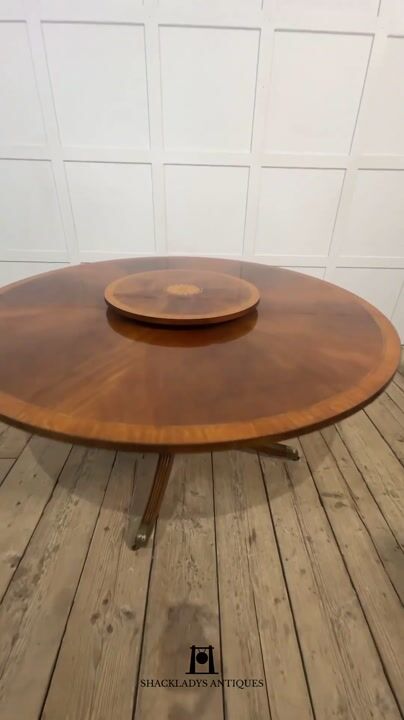 Film of Mahogany Cross Banded Circular Dining Table