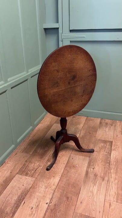 Film of A Good Solid Country Oak Tilt Top Table