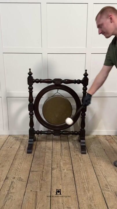 Film of Oak and Brass Dinner Gong