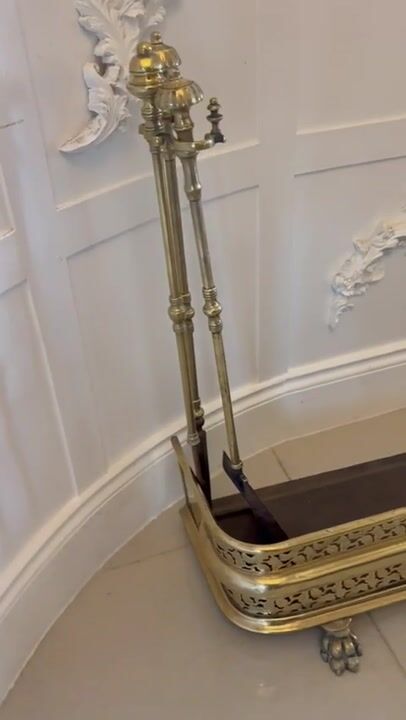 Film of Unusual and Rare Quality Antique Regency Brass Fender with Original Fire Irons