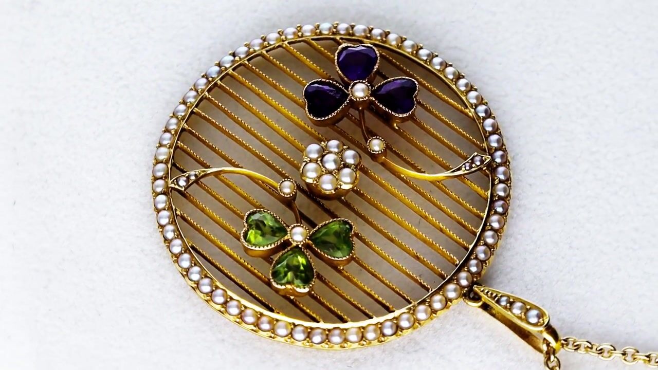 Film of 1.00ct Peridot 0.75ct Amethyst Seed Pearl 18ct Yellow Gold Pendant Circa 1910