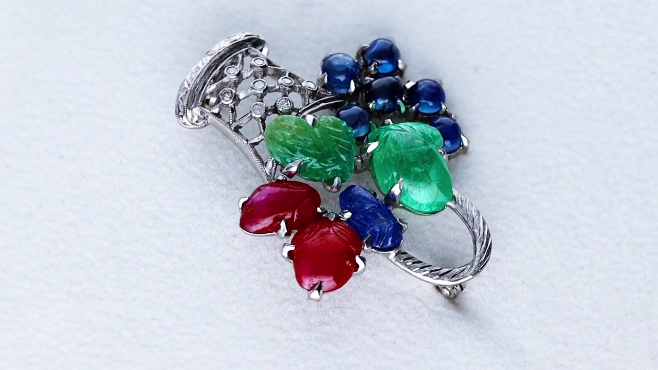 Film of Antique 2.10ct Sapphire 2.92ct Emerald 3.02ct Ruby 0.12ct Diamond and 18ct White Gold Tutti Frutti Basket Brooch Circa 1915