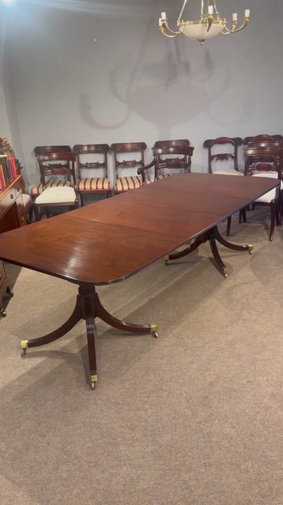 Film of Georgian Style Mahogany Twin Pillar Dining Table with Leaves