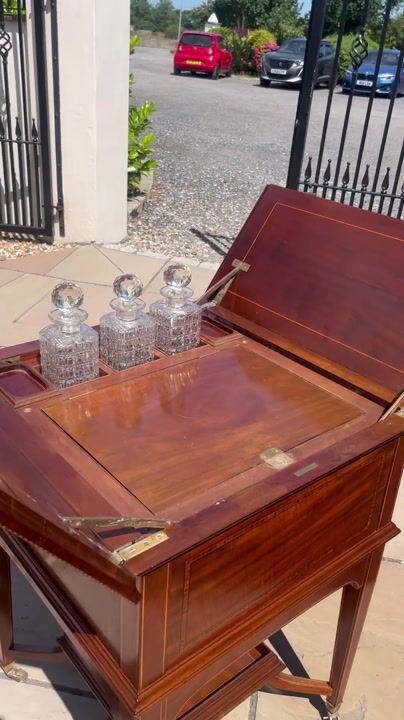 Film of A Fine Quality Edwardian Period Mahogany and Satinwood Inlaid Surprise Drinks Cabinet.