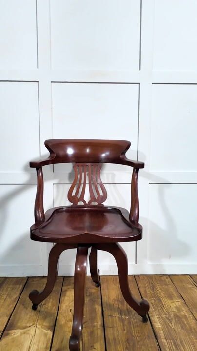 Film of Mahogany Revolving Desk Chair