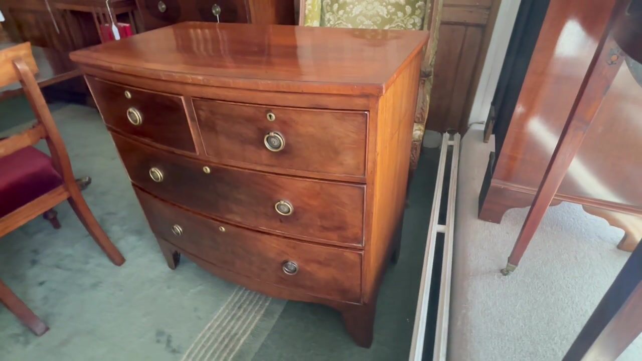 Film of Small Regency Mahogany and Crossbanded Bow Front Chest of Drawers