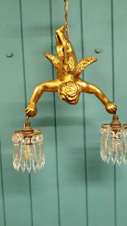 Film of Antique Gilt Spelter Flying Cherub with Two Cut Glass Crystal Spike Chandeliers