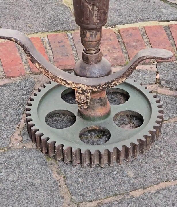 Film of Pair of Heavy Industrial Bar Stools with Late 19th-century Blackstone & Co. Cast-iron Seats and Gear Cog Bases