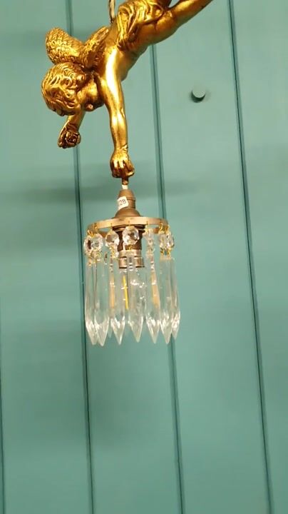 Film of Antique Gilt Spelter Flying Cherub with Cut Glass Crystal Spike Chandelier 9"