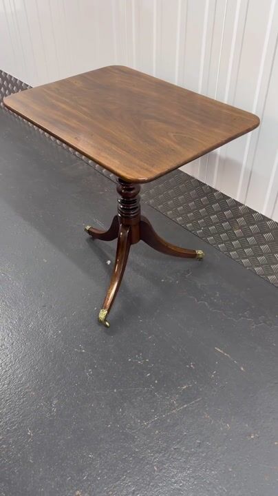 Film of Antique Regency Mahogany Tilt Top Occasional Table with Brass Casters