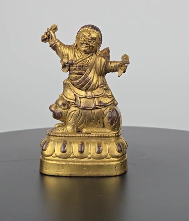 Film of A Fine Sino-tibetan Gilt-bronze Votive Figure of a Wrathful Buddhist Protector Deity Seated on a Tiger ​Sixteenth to Seventeenth Century