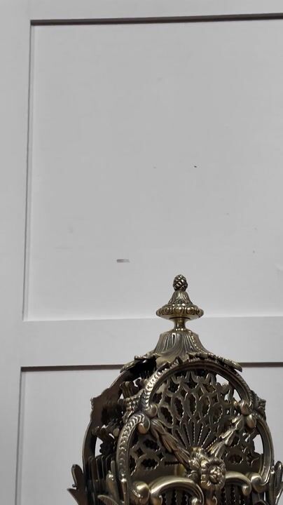 Film of Pierced Brass Peacock Fire Fan
