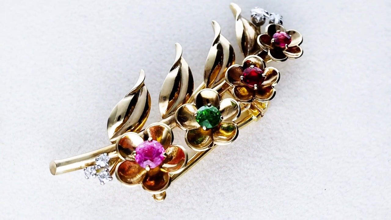 Film of 0.30ct Garnet, 0.23ct Peridot, 0.19ct Spinel and 0.25ct Diamond, 9ct Yellow Gold Brooch by Cartier - Antique Circa 1925