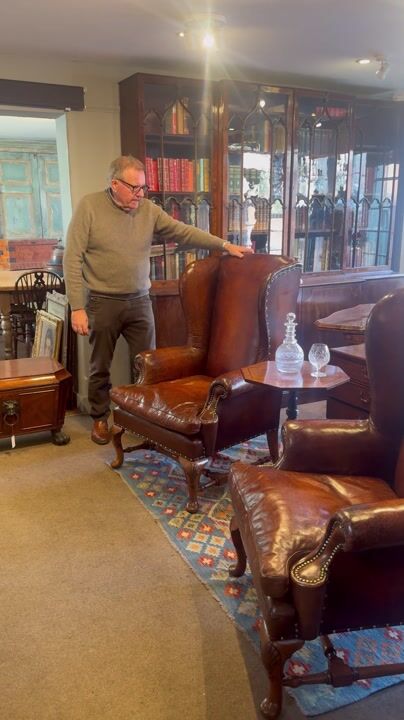 Film of Pair of Queen Anne Style Leather Wingback Chairs in Walnut with Cabriole Legs