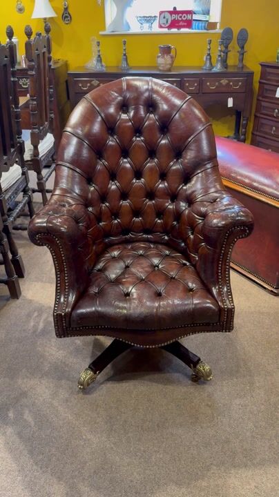 Film of Captains Buttoned Leather Desk Chair with Cast Brass Castors