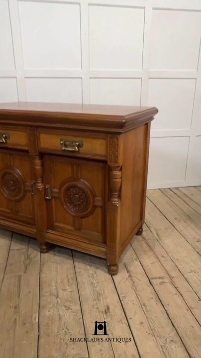 Film of Carved Oak Two Door Sideboard by Maple and Co